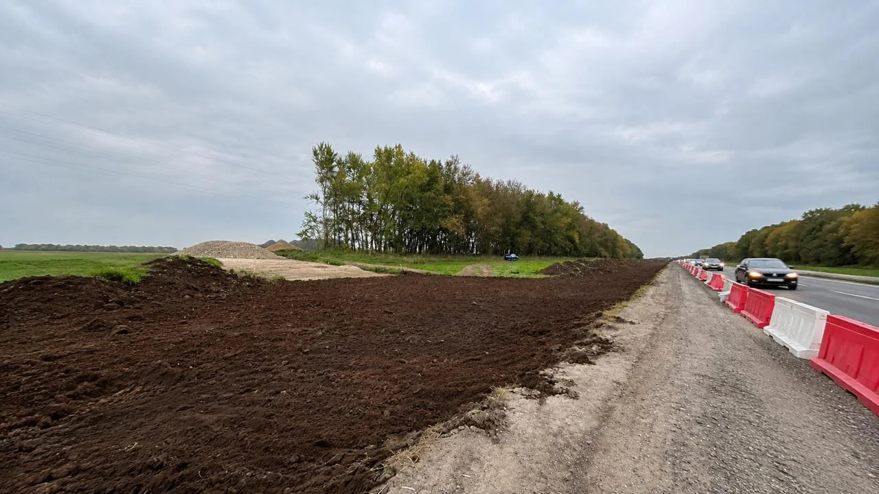 Site preparation along the highway for the new road connection